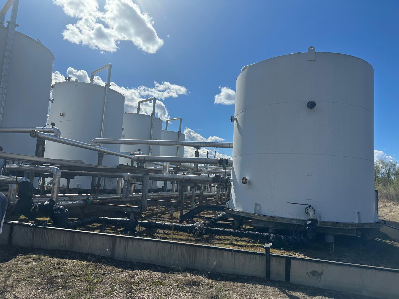 Company-supplied photograph of production and storage tanks