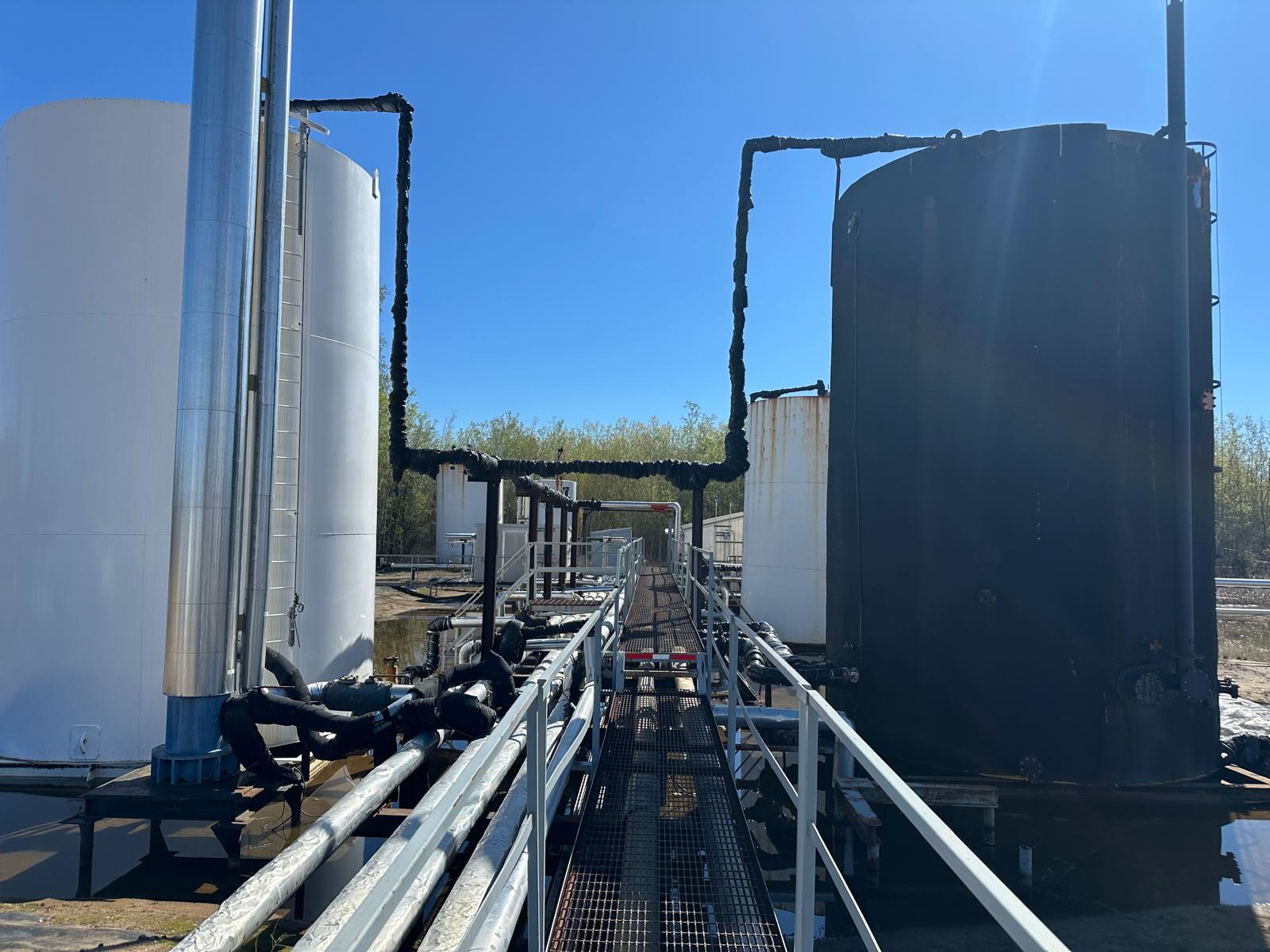 Company-supplied field infrastructure photograph for Tuscany Petroleum